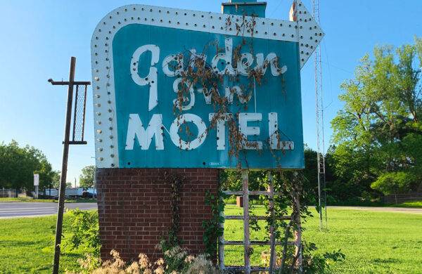 Neon road garden inn motel sign before restoration
