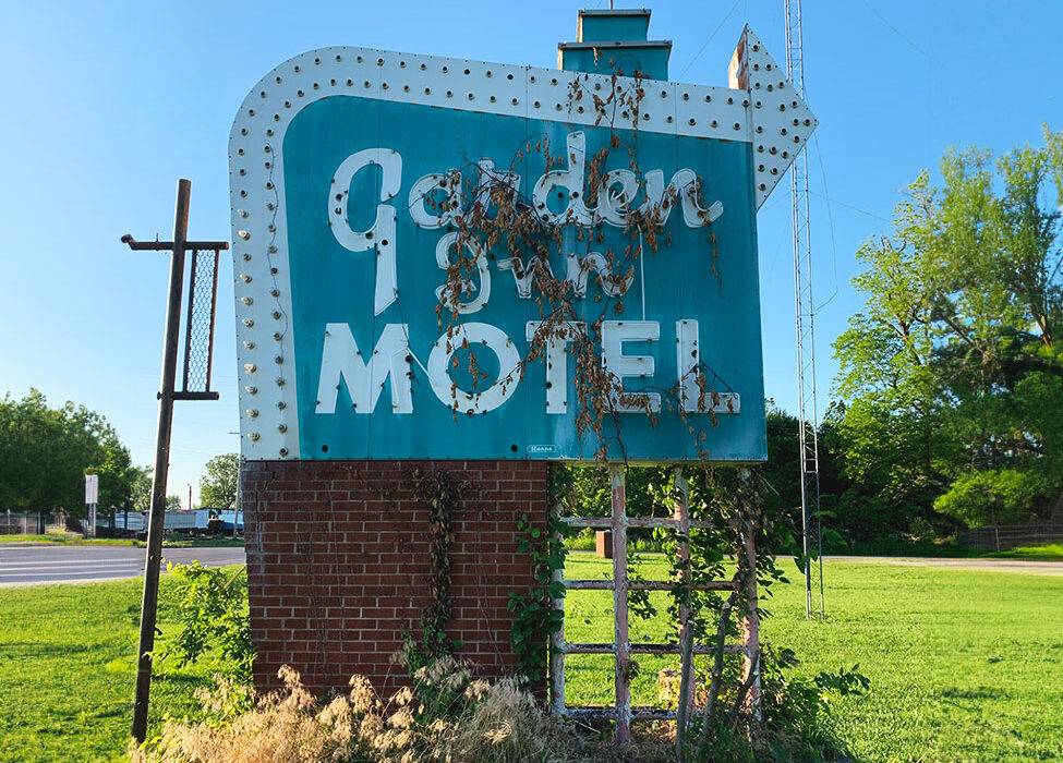 Neon road garden inn motel sign before restoration