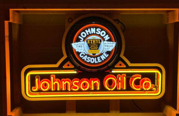 Neon road johnson oil co gasolene sign lit up