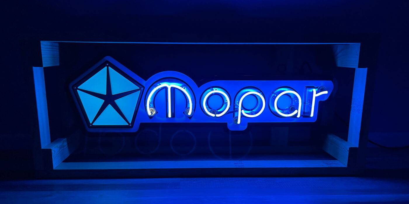 Neon road blue mopar sign lit on