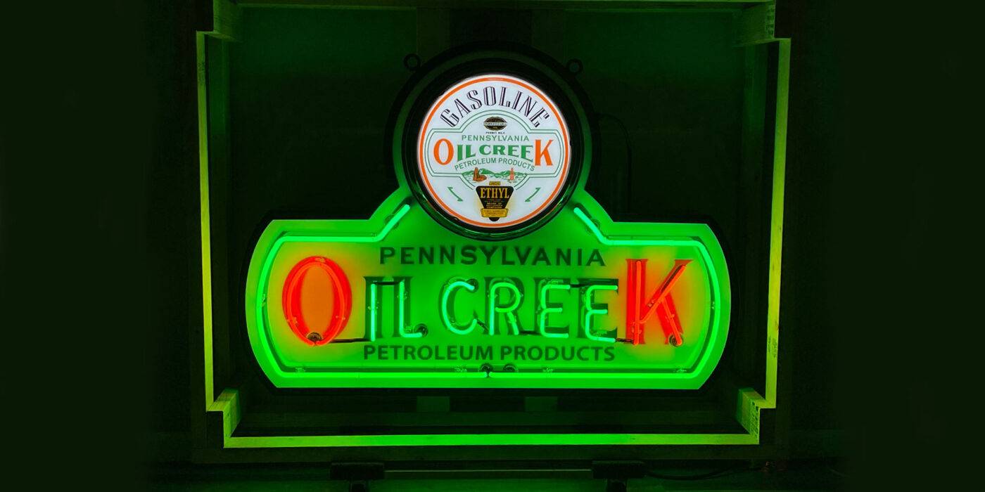 Neon road Oil creek pennylvania petroleum products green sign