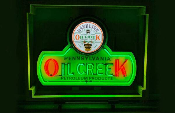 Neon road Oil creek pennylvania petroleum products green sign