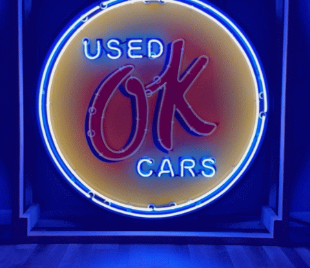 Neon road used ok cars round sign