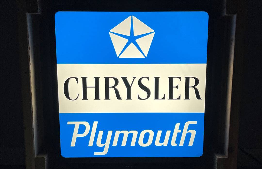 Neon road chrysler plymouth sign