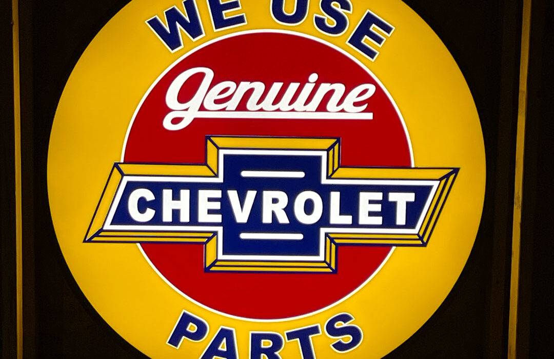 Neon road genuine chevrolet parts round sign