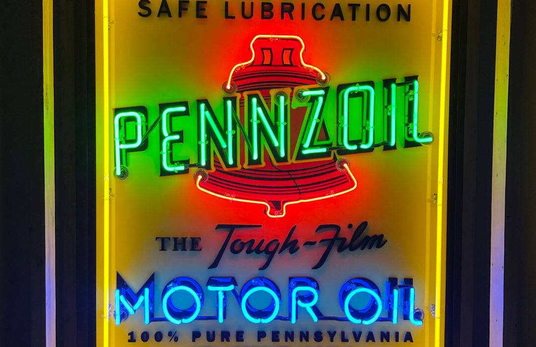 Neon road Pennzoil Motor OIl sign lit on